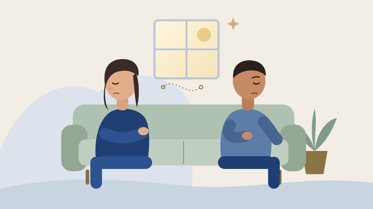 Flat illustration of a man and a woman sitting apart on a sofa, looking away from each other, with a plant and a softly lit window behind them